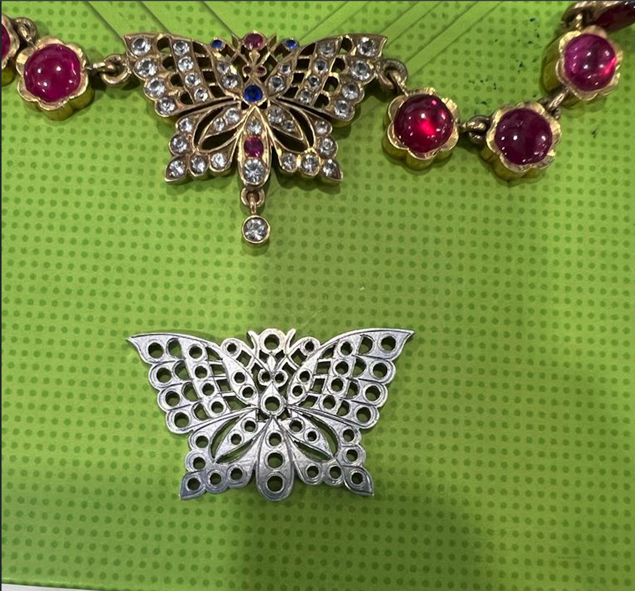 Close view of the finished ruby-and-diamond butterfly pendant